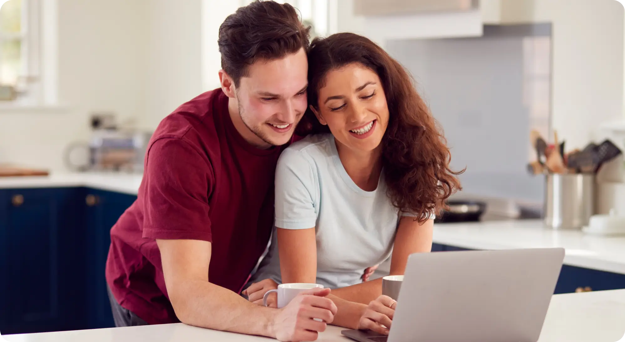 A couple smiling together at home